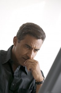 Man Thinking at Computer